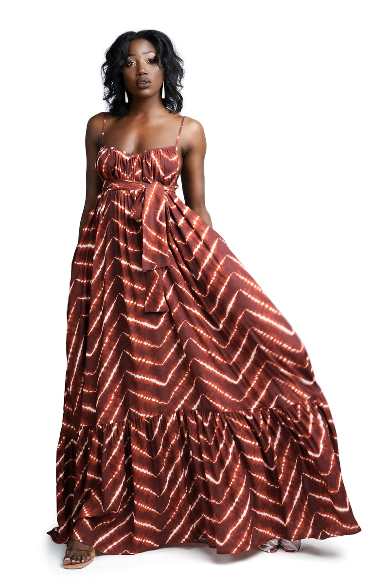 Model wearing orange tie-die African print summer maxi dress