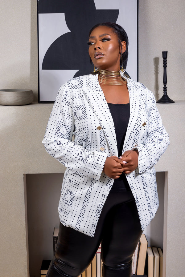 Model wearing White Mudcloth African print blazer and black pants