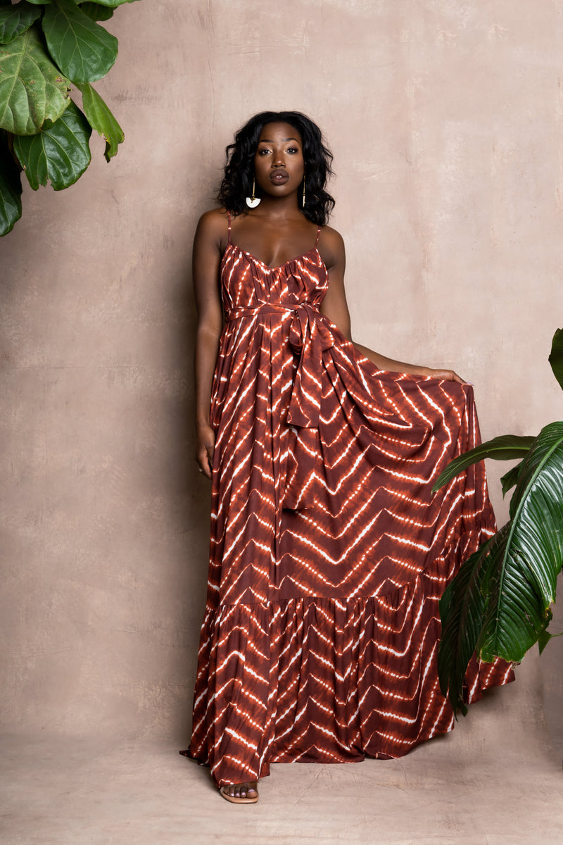 Model wearing orange tie-die African print summer dress