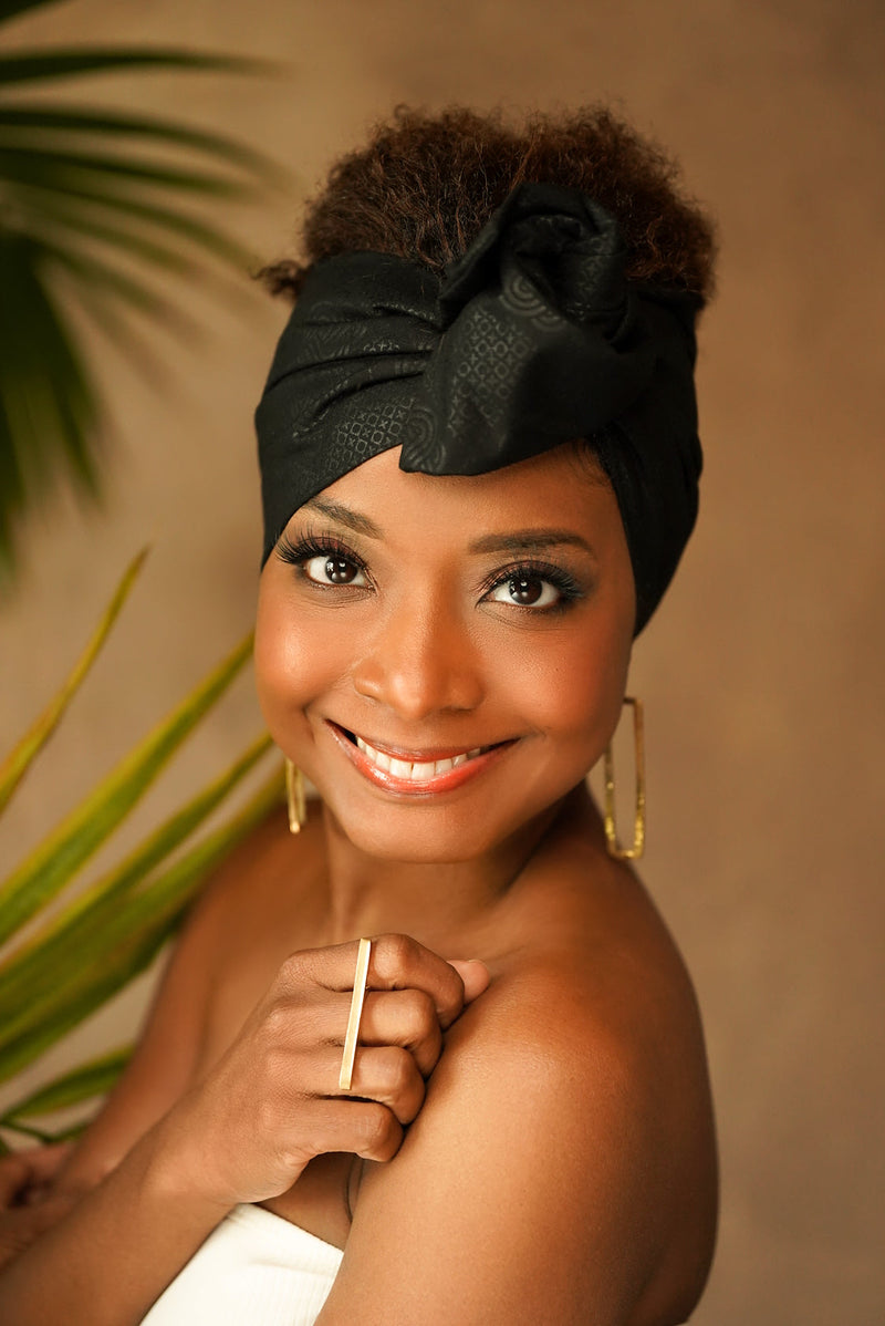 woman wearing african print headwrap black
