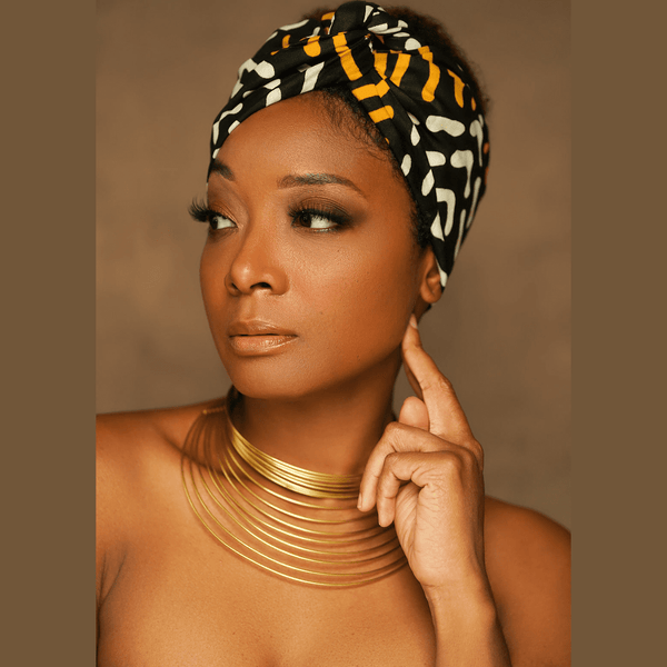 african print headwrap in gold black white