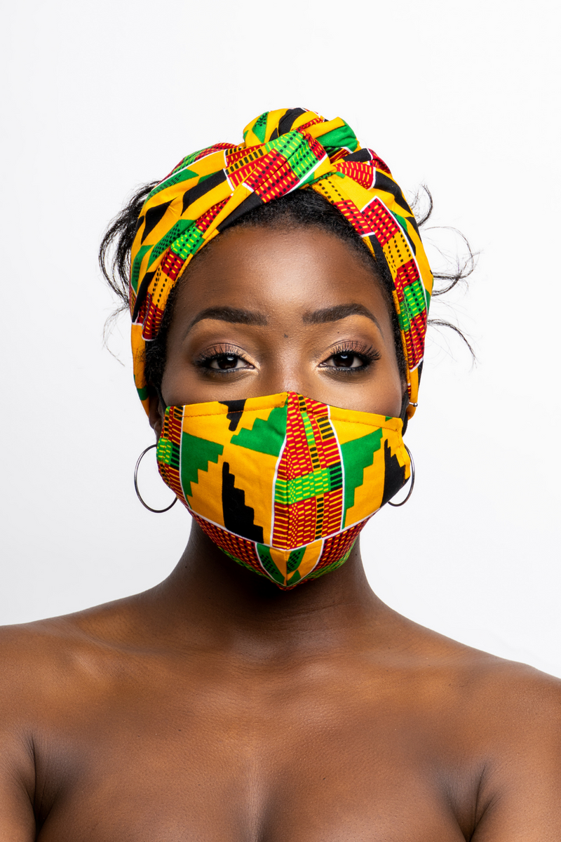 woman wearing african print headwrap and mask yellow, green, red 2