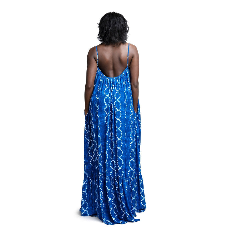 woman wearing indigo african print summer dress back
