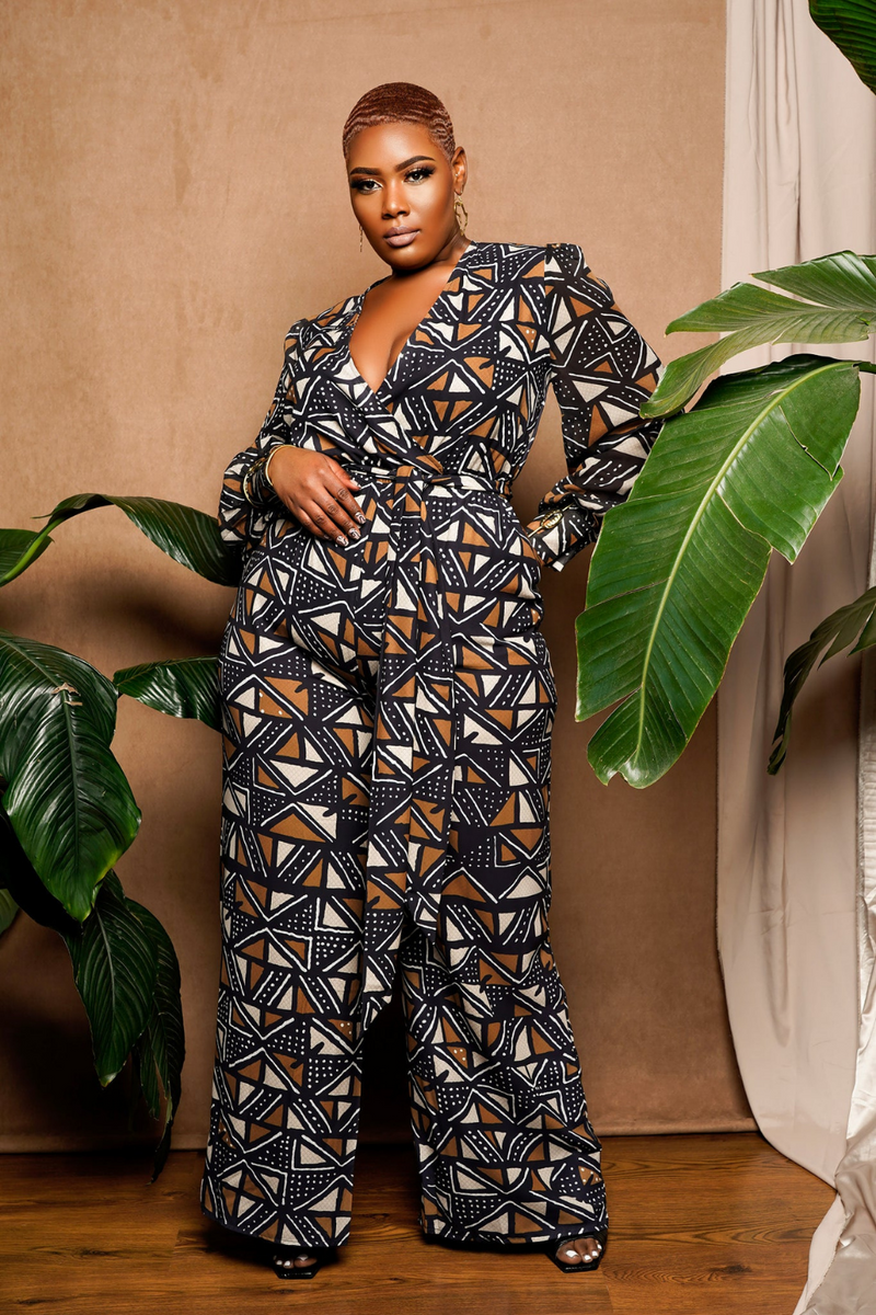 woman wearing jumpsuit made from mudcloth african print in black and brown