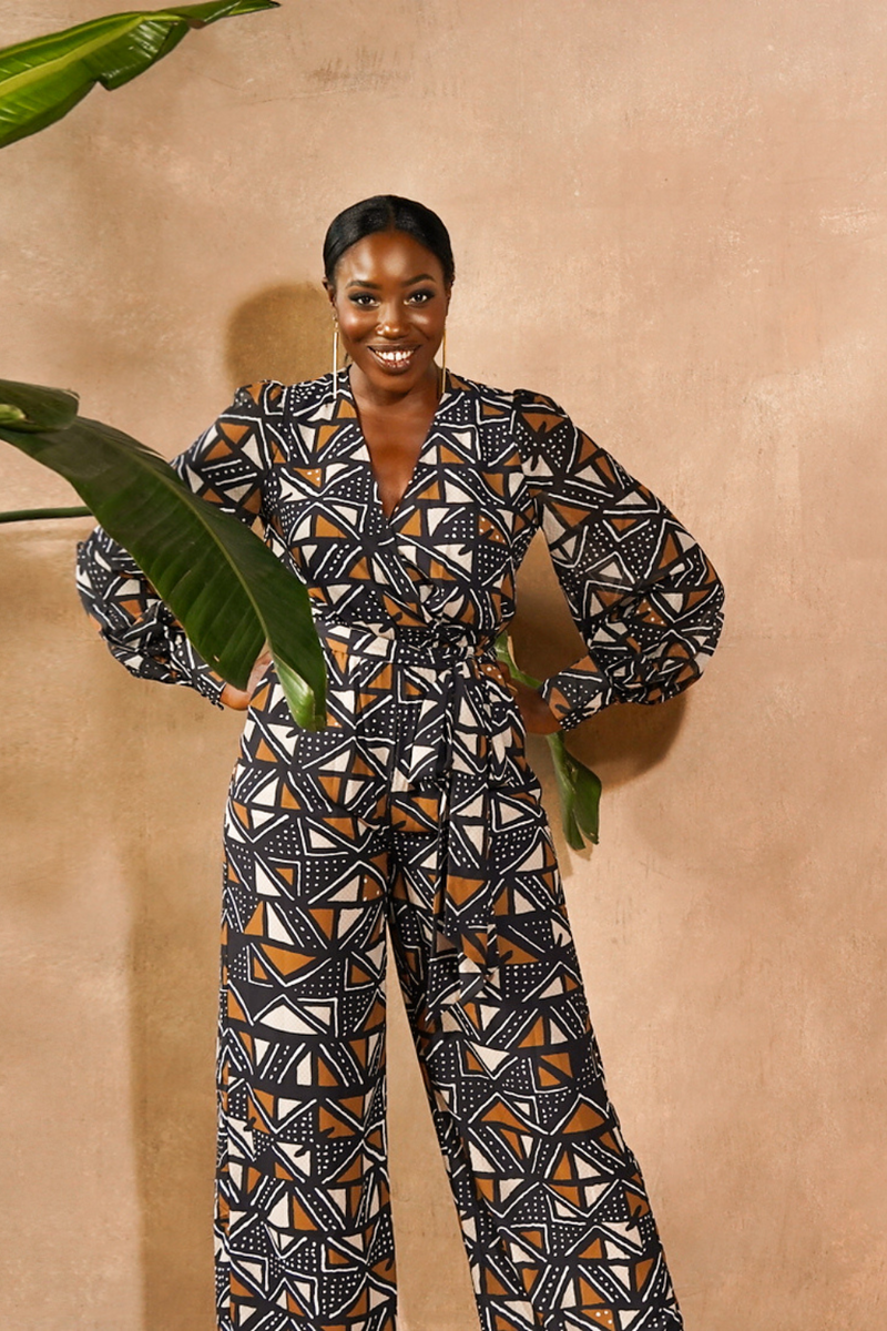 woman wearing jumpsuit made from mudcloth african print in black and brown