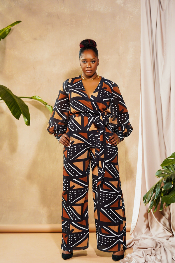 woman wearing jumpsuit made from mudcloth african print brown front