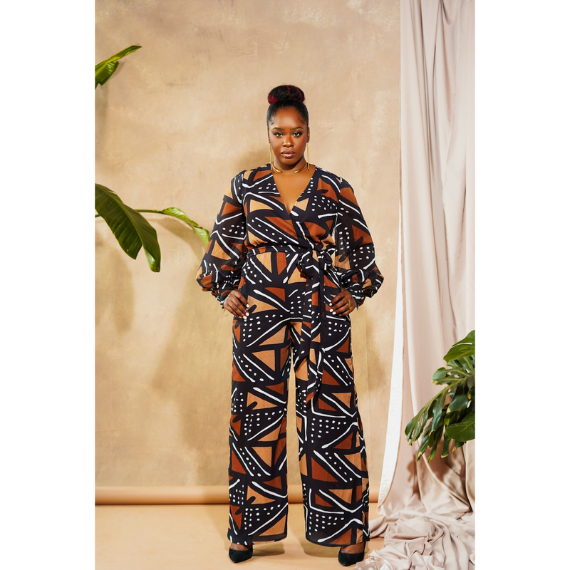 woman wearing jumpsuit made from mudcloth african print brown front