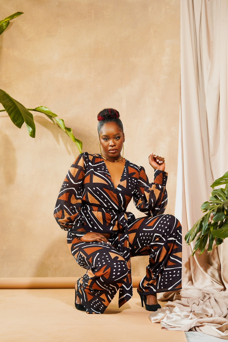 woman wearing jumpsuit made from mudcloth african print brown