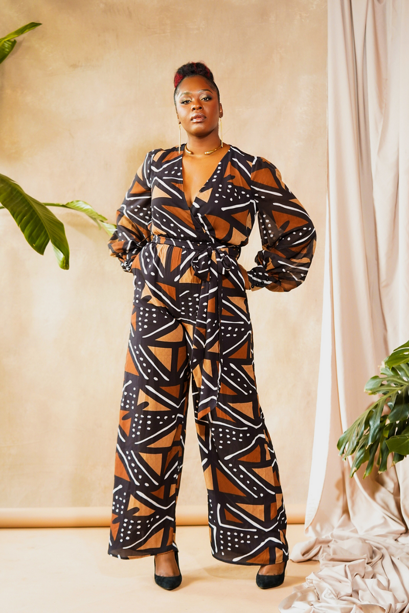 woman wearing jumpsuit made from mudcloth african print brown