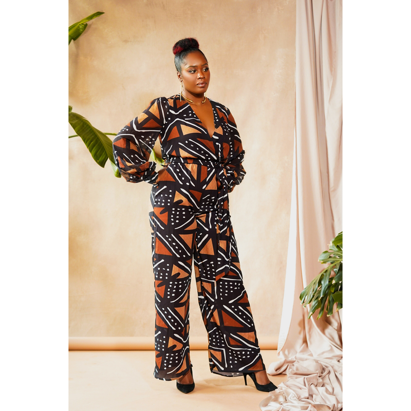 woman wearing jumpsuit made from mudcloth african print brown
