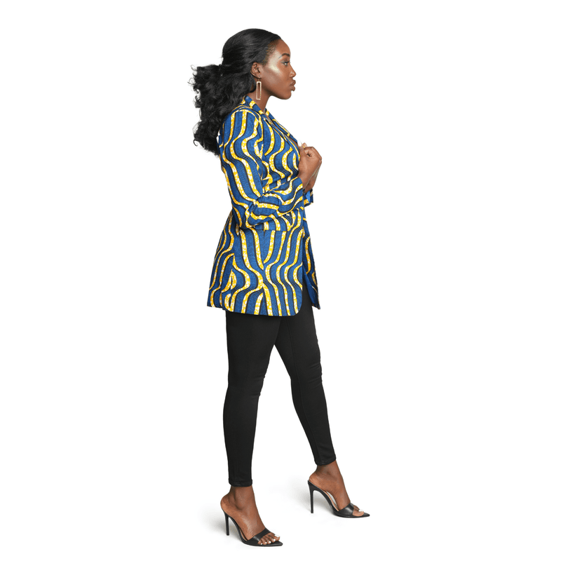 woman wearing african print blazer in blue and yellow side