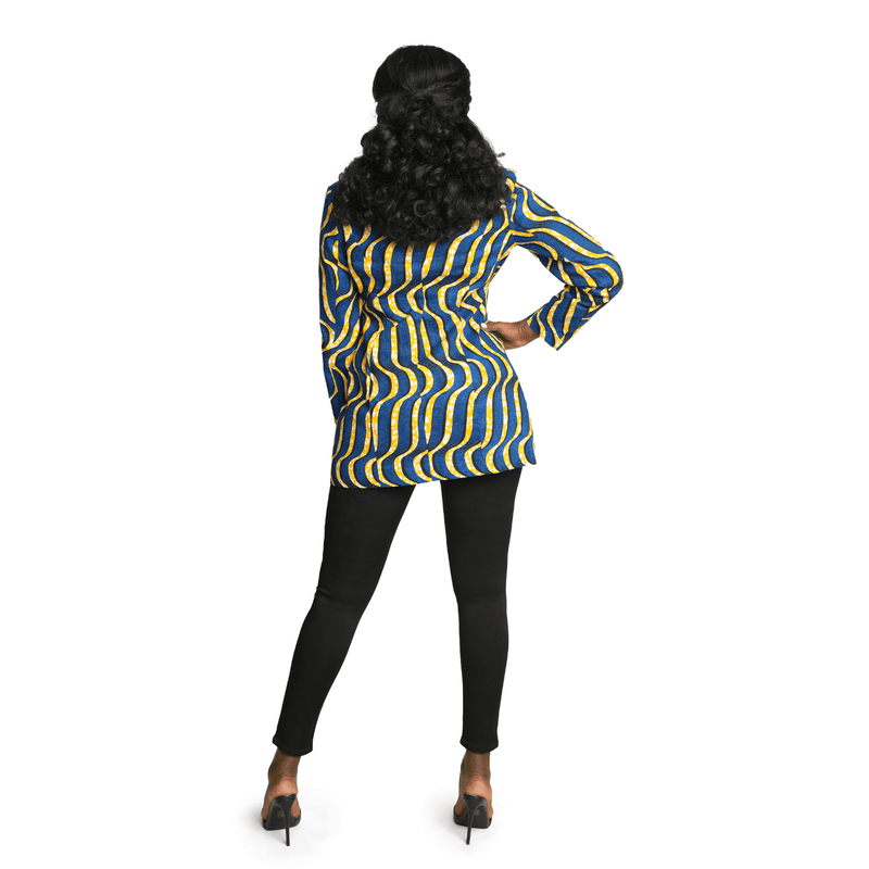woman wearing african print blazer in blue and yellow back