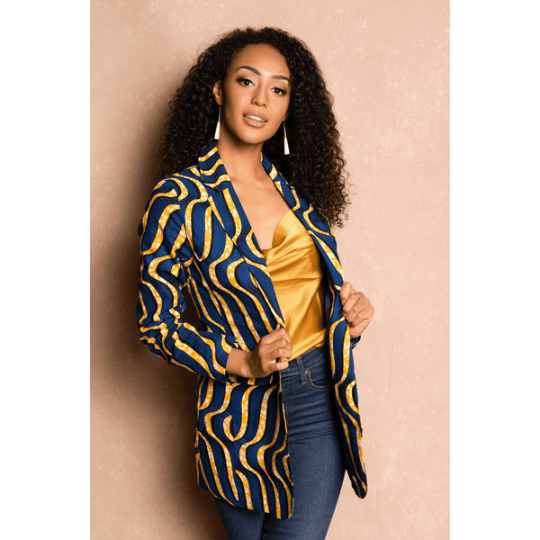 woman wearing african print blazer in blue and yellow