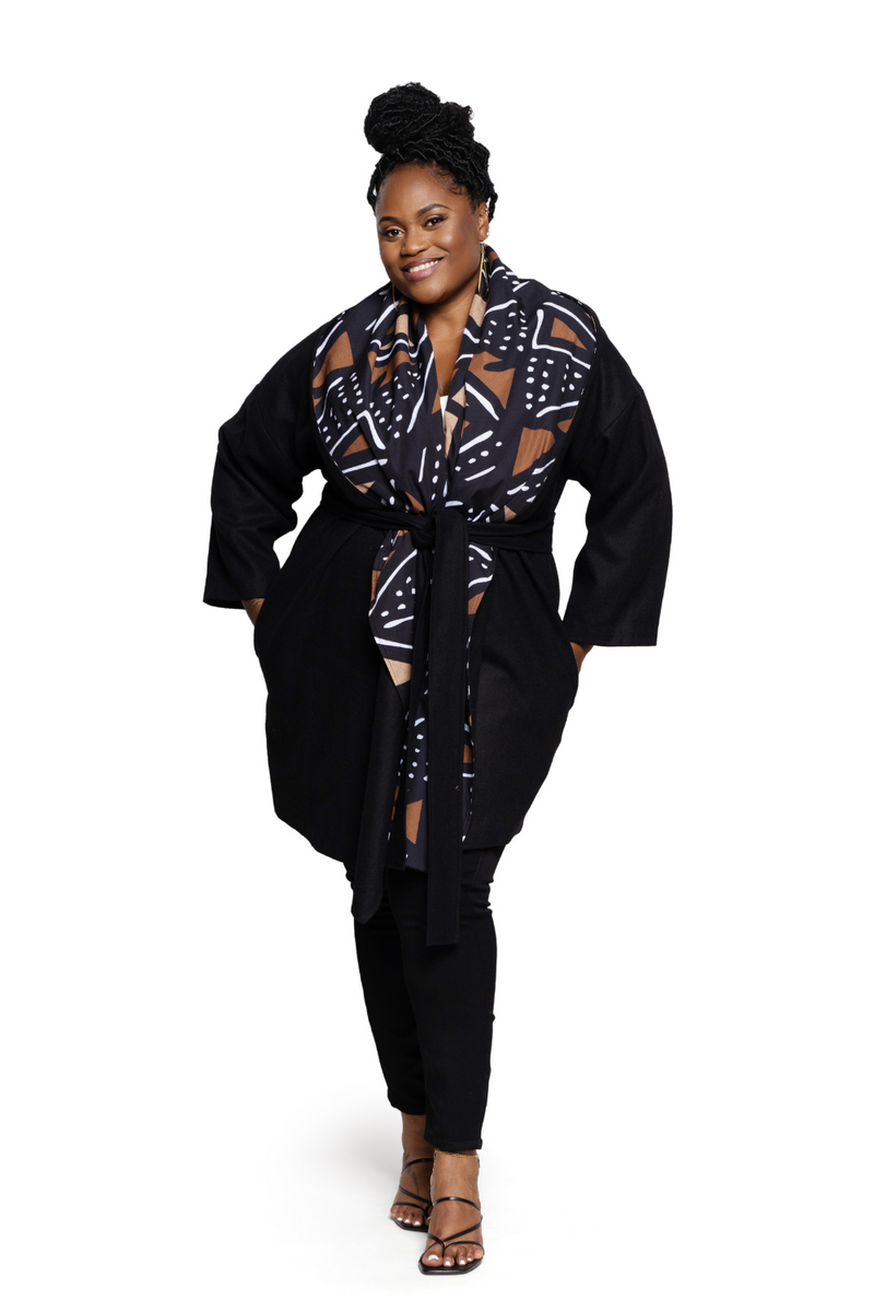woman wearing mudcloth african print coat in black