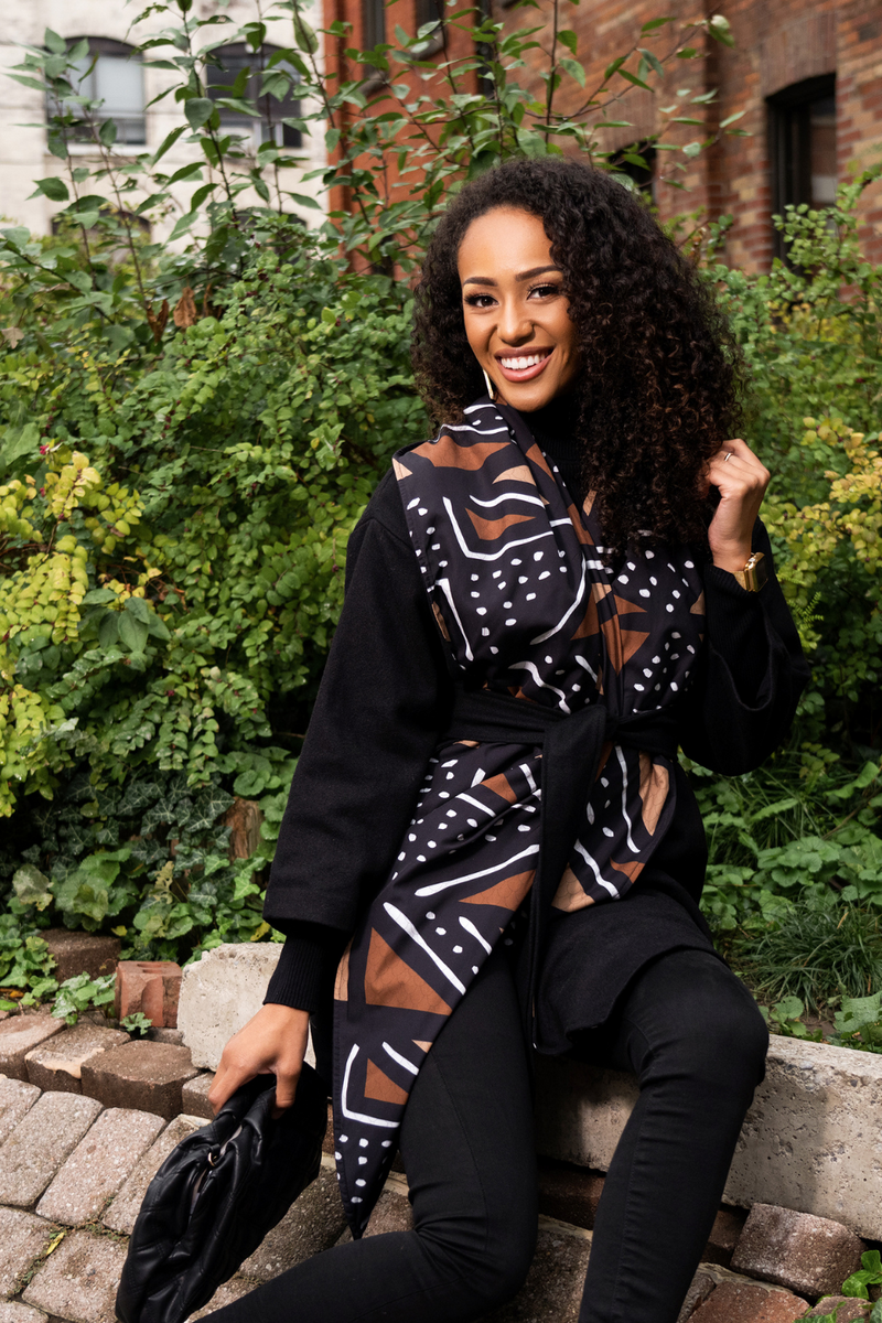 woman wearing mudcloth african print coat in black