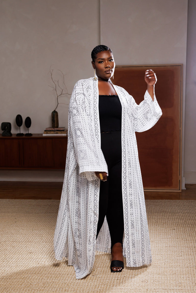 woman wearing white mudcloth african print kimono dress